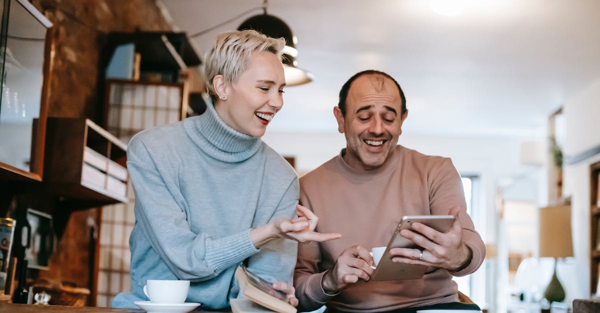 Is there a point to gaining "Connected:" quality after a certain point? - Cheerful adult diverse couple in casual clothes watching funny video on tablet and laughing while drinking coffee at table in apartment Is there a point to gaining "Connected:" quality after a certain point? - Cheerful adult diverse couple in casual clothes watching funny video on tablet and laughing while drinking coffee at table in apartment
