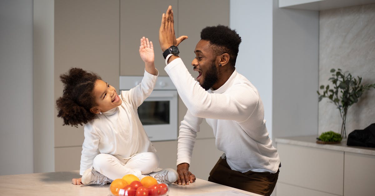 Is there a quicker way for me to give items to other characters? - Joyful black father giving high five to adorable daughter Is there a quicker way for me to give items to other characters? - Joyful black father giving high five to adorable daughter