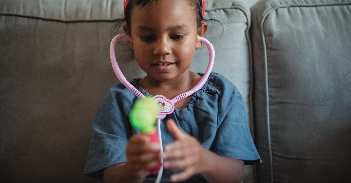 Is there a risk of inbred children with fake fatherhood? - Cheerful Asian girl playing with stethoscope