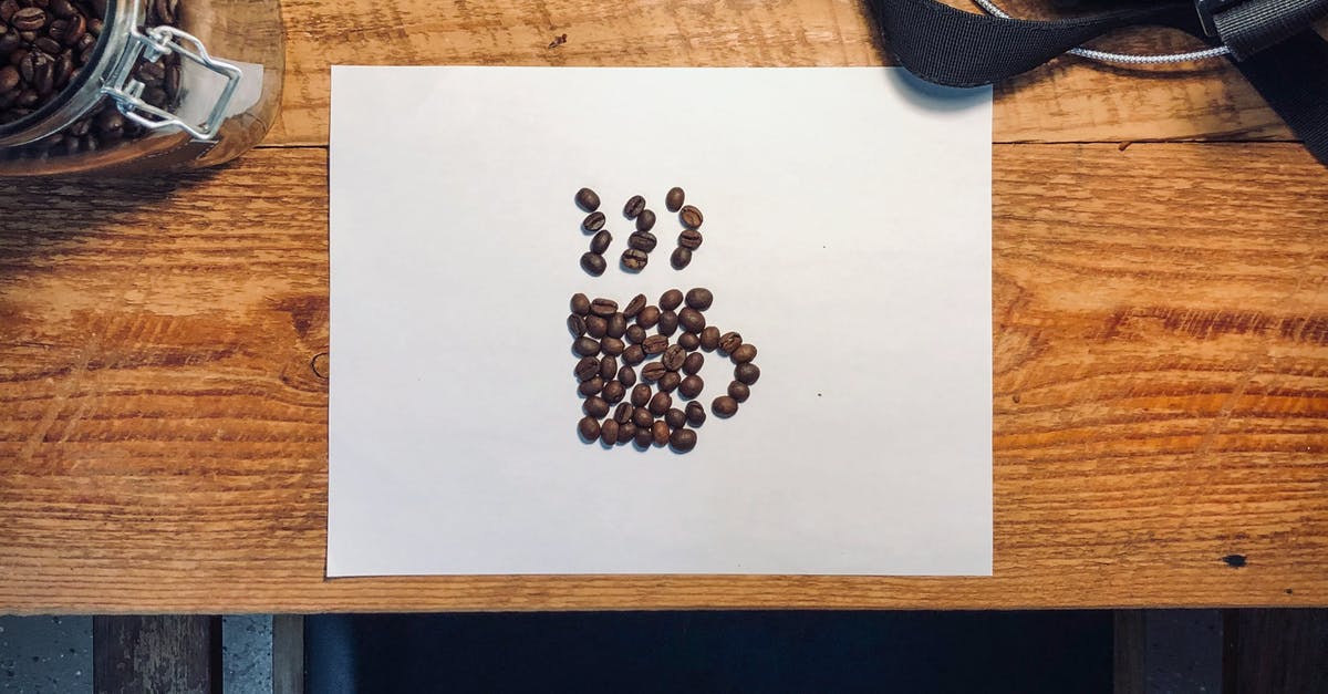 Is there a solid advantage to feeding beans to Paper Mario? - Roasted Coffee Beans Arranged in a Cup Shape on White Paper