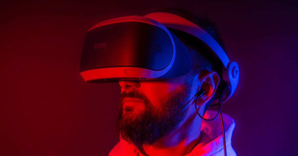 Is there a standardized rating system for game difficulty? - Young bearded man entertaining with VR glasses in colorful neon light on black background Is there a standardized rating system for game difficulty? - Young bearded man entertaining with VR glasses in colorful neon light on black background
