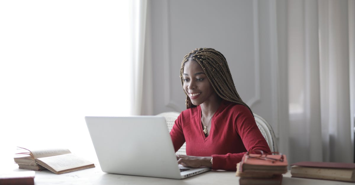 Is there a use for burnt books or magazines? - Woman in Red Long Sleeve Shirt Using Macbook Air