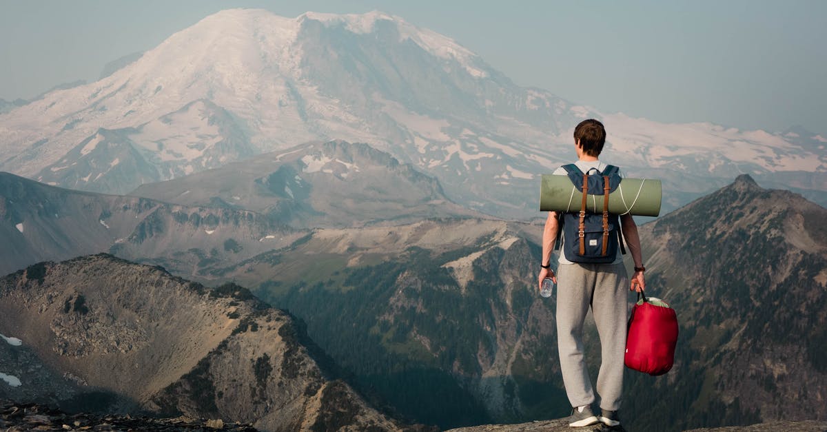 Is there a walkable trail to the top of Whitesky Peak? - Unrecognizable backpacker standing on top of mountain