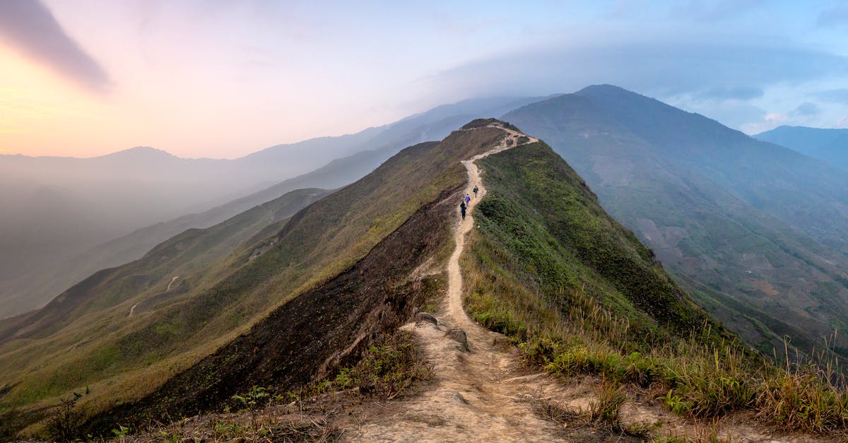 Is there a walkable trail to the top of Whitesky Peak? - Group of travelers walking on path on grassy top of mountain ridge located in mountainous valley in mist Is there a walkable trail to the top of Whitesky Peak? - Group of travelers walking on path on grassy top of mountain ridge located in mountainous valley in mist