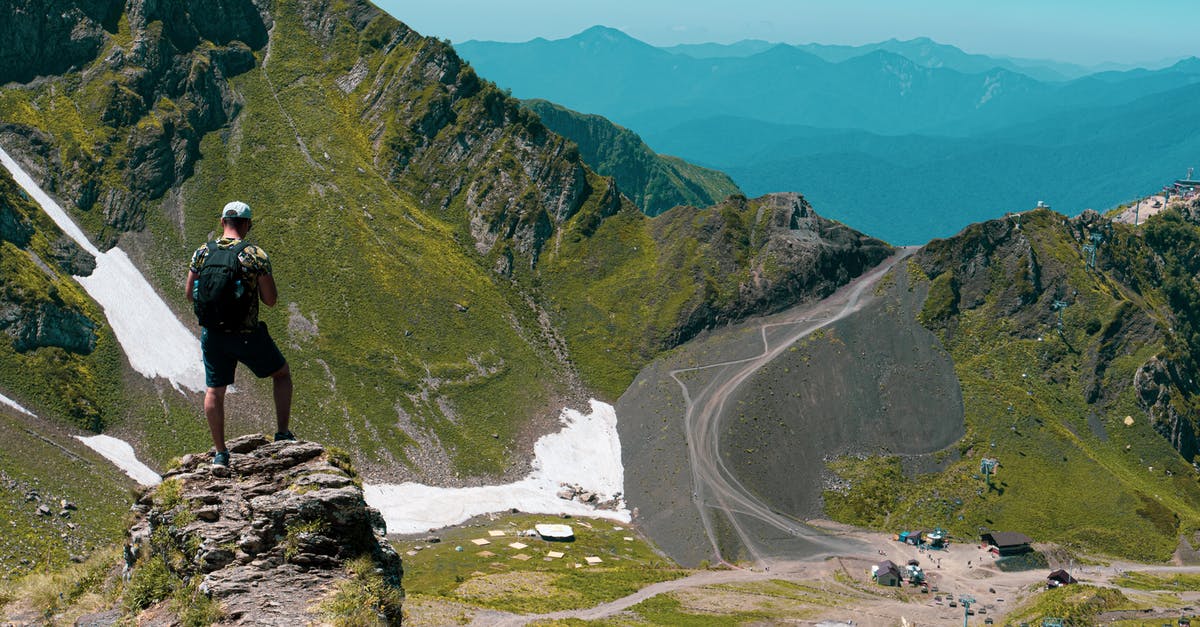 Is there a walkable trail to the top of Whitesky Peak? - A Person with Backpack Standing on a Mountain Rock with Snow Is there a walkable trail to the top of Whitesky Peak? - A Person with Backpack Standing on a Mountain Rock with Snow
