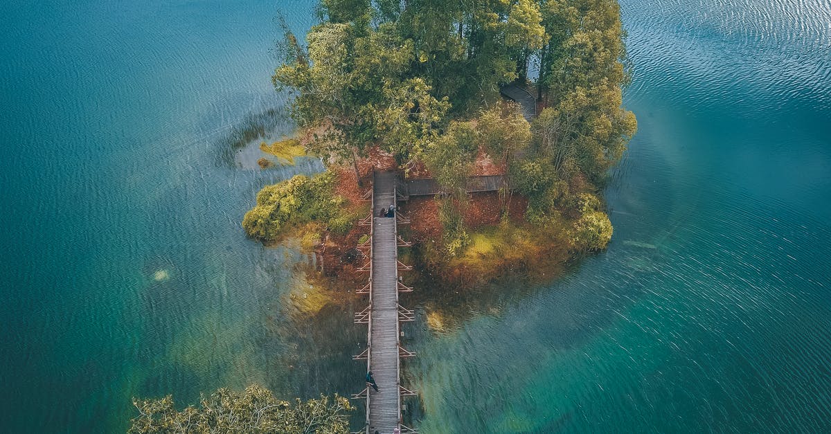 Is there a way to clear quests from your journal in skyrim - Wooden bridge leading to small green island in water