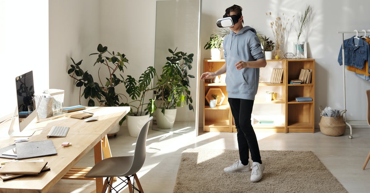 Is there a way to continue playing the 2018 Google Halloween game? - Photo of Boy Standing While Using Vr Headset