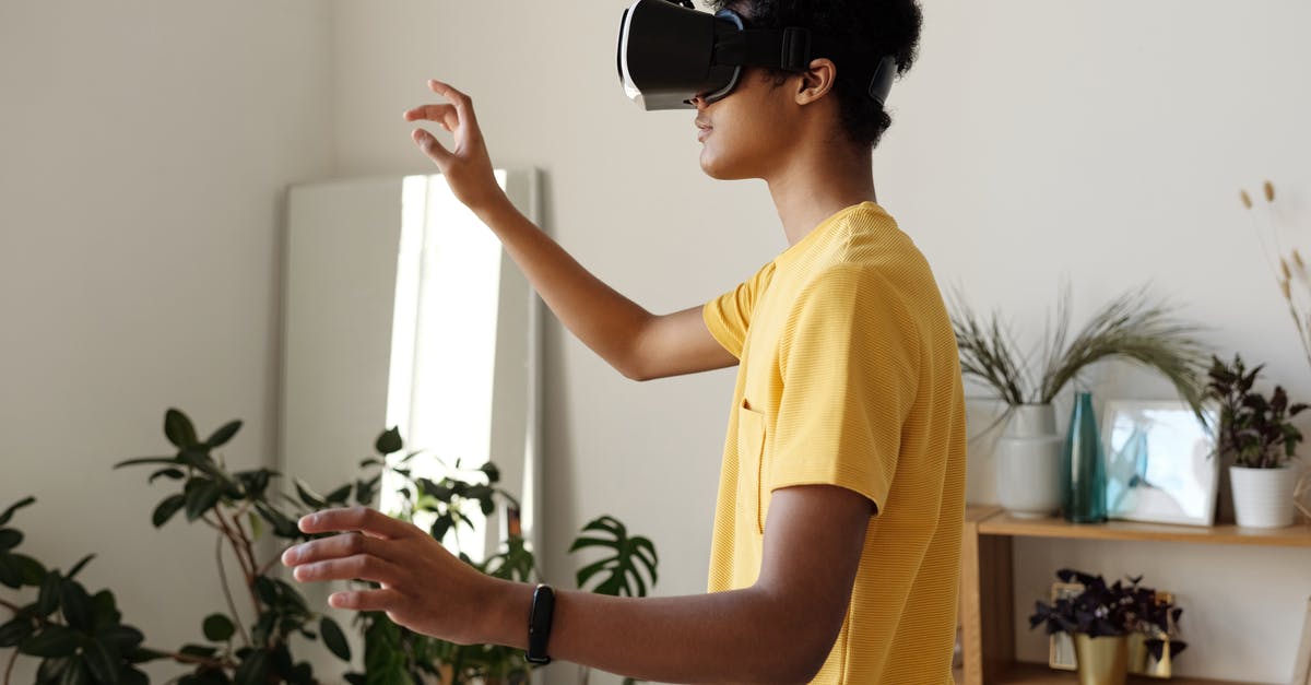 Is there a way to continue playing the 2018 Google Halloween game? - Boy in Yellow T-shirt Wearing Vr Headset