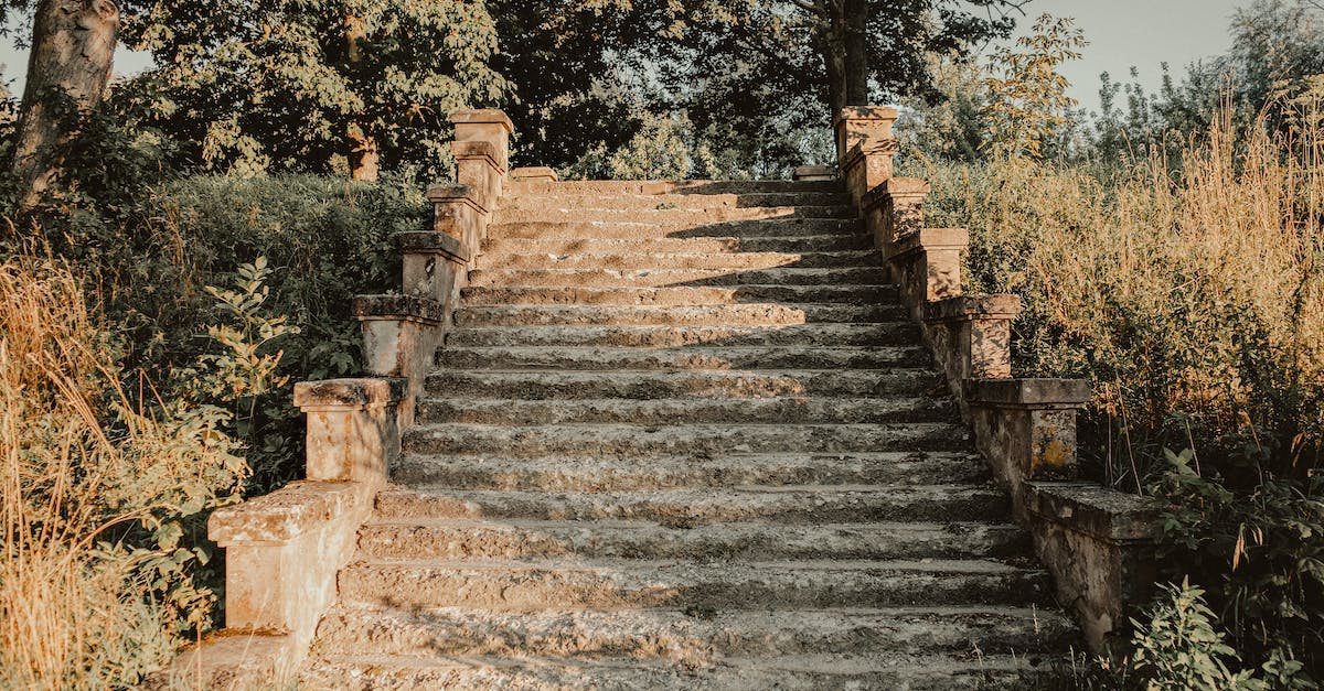 Is there a way to destroy spike balls? [duplicate] - Old shabby stone stairway amidst lush green trees and grass on sunny day in park