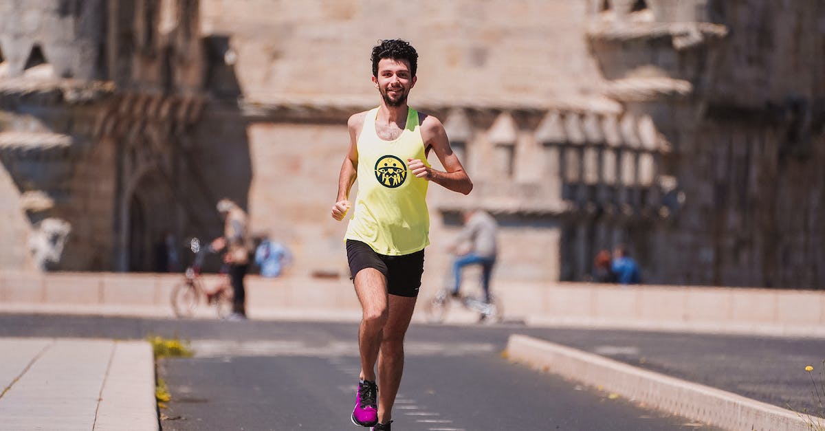 Is there a way to determine character motivations? - Full body of happy young male athlete in sportswear running on asphalt path against ancient castle during outdoor fitness training Is there a way to determine character motivations? - Full body of happy young male athlete in sportswear running on asphalt path against ancient castle during outdoor fitness training
