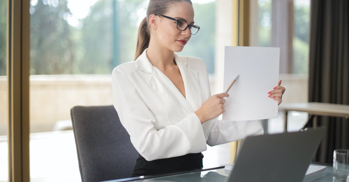 Is there a way to determine which computer I need to hack in The Big Bank heist? - Determine female executive manager in formal wear sitting at table with laptop in office and explaining business plan Is there a way to determine which computer I need to hack in The Big Bank heist? - Determine female executive manager in formal wear sitting at table with laptop in office and explaining business plan