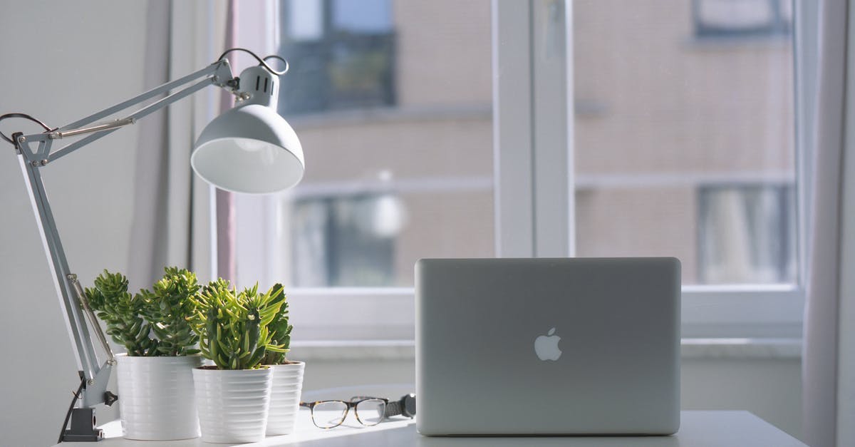 Is there a way to download Windows games on Steam but for my Macbook Pro? [duplicate] - Silver Macbook Air and Goose Neck Lamp