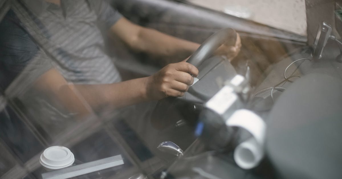 Is there a way to drive the Marked Man opponents' version of the Hunter Civilian? - Through glass of crop anonymous male in casual clothes driving modern taxi car on road in daytime Is there a way to drive the Marked Man opponents' version of the Hunter Civilian? - Through glass of crop anonymous male in casual clothes driving modern taxi car on road in daytime