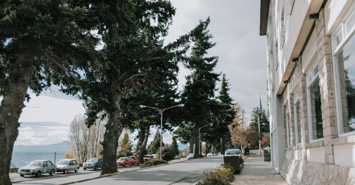 Is there a way to get both sets of loot at the end of the mysterious car park? - Narrow road with parked cars near sea