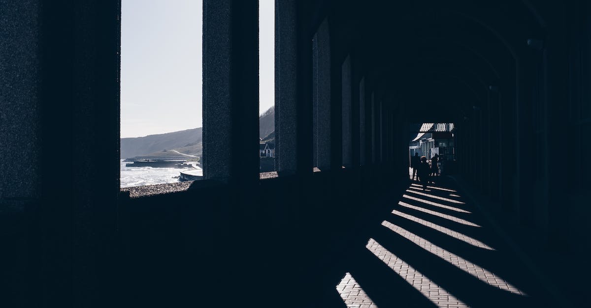 Is there a way to get data out of Age of Empires 3's view postgame? - Silhouettes of faceless people walking along passage with arched windows located at seafront on sunny day