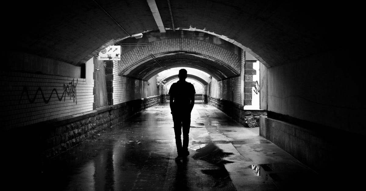 Is there a way to know how much water I have? - Silhouette Photo of a Man in a Tunnel
