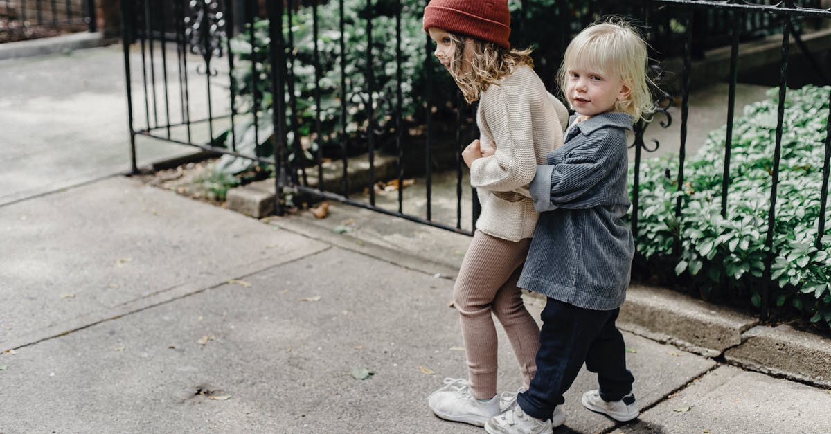 Is There a Way to Play the Original Donkey Kong on the PS4? - Adorable children cuddling on pathway
