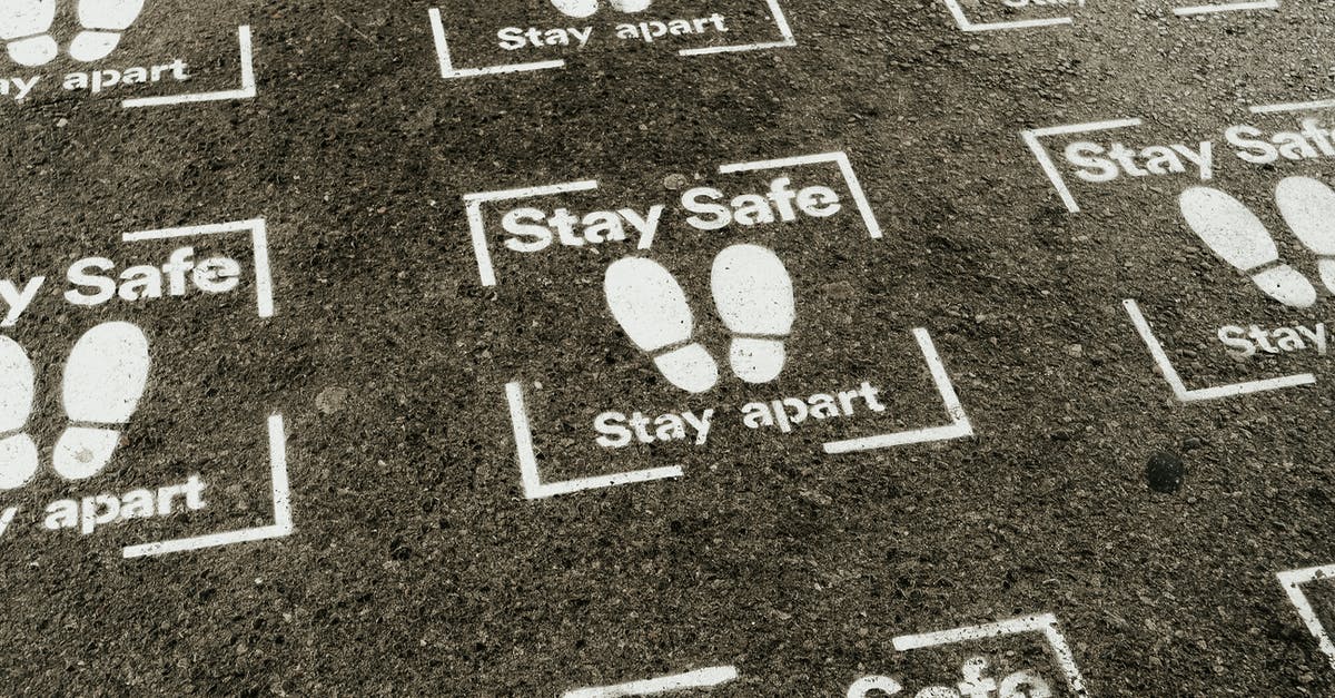 Is there a way to prevent auto-exit from Lucioball? - From above white sign of feet and inscription Stay Safe Stay Apart painted on asphalt road during coronavirus outbreak