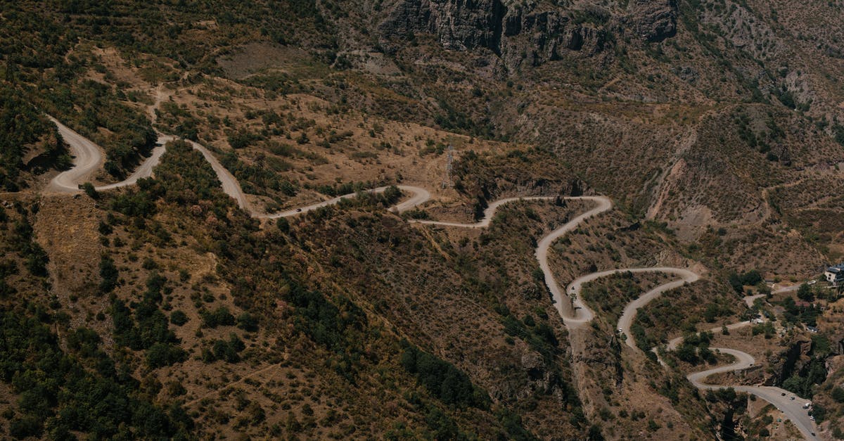 Is there a way to prevent wild Pokémon from running away in battle? - Asphalt winding roadway on mountain slope