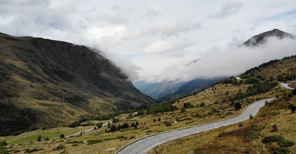 Is there a way to prevent wild Pokémon from running away in battle? - Scenic landscape of road in mountainous valley against misty sky