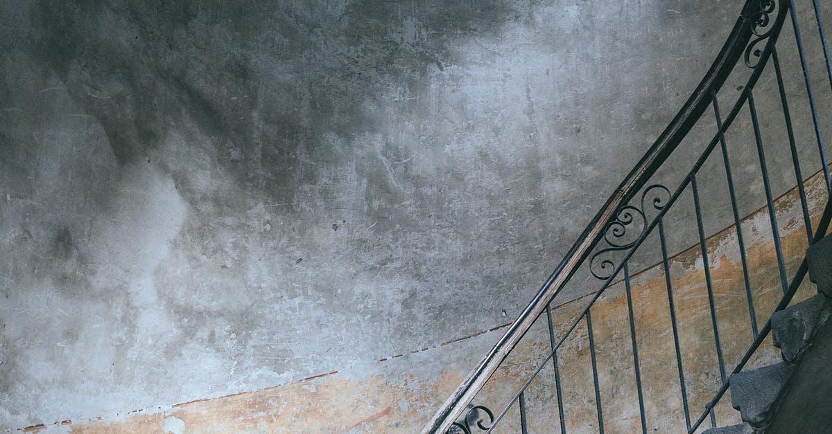 Is there a way to reduce or eliminate the damage taken from rocket jumps? - Stairway with metal railings and old shabby walls in porch of dwell building in city Is there a way to reduce or eliminate the damage taken from rocket jumps? - Stairway with metal railings and old shabby walls in porch of dwell building in city