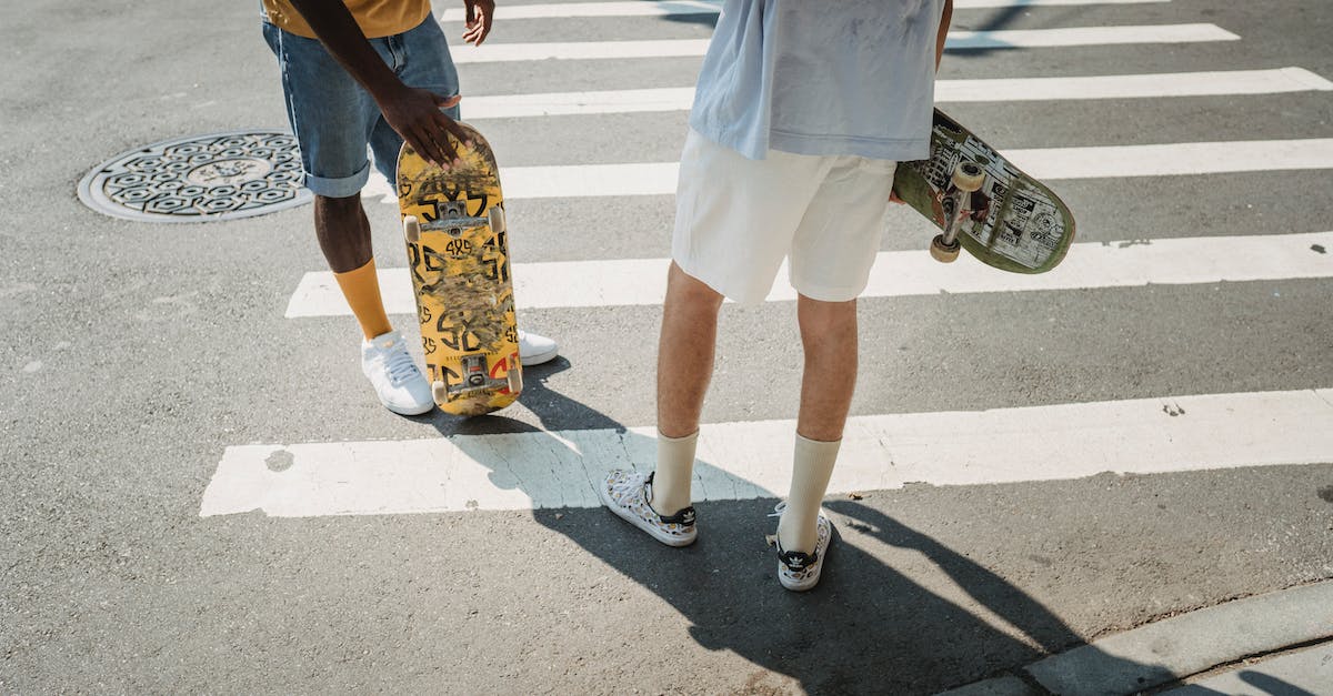 Is there a way to respec my skills? - Crop men with skateboards on crosswalk