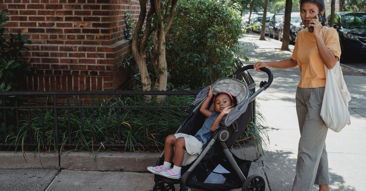 Is there a way to retrace previous conversation between characters in transcript? - Full body of serious ethnic woman with bag speaking on smartphone while standing on pavement near girl in baby stroller Is there a way to retrace previous conversation between characters in transcript? - Full body of serious ethnic woman with bag speaking on smartphone while standing on pavement near girl in baby stroller