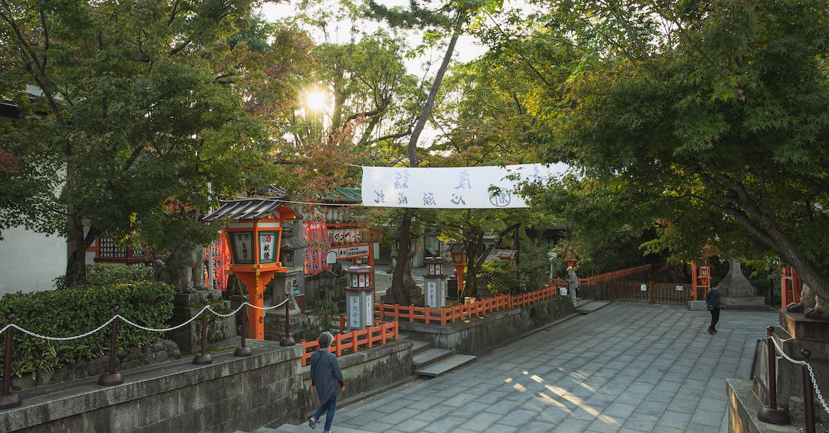 Is there a way to see who will win the election for Holy Roman Emperor in EU4? - Unrecognizable people walking on paved pathway near green trees while sightseeing ancient Yasaka Shrine located in Kyoto
