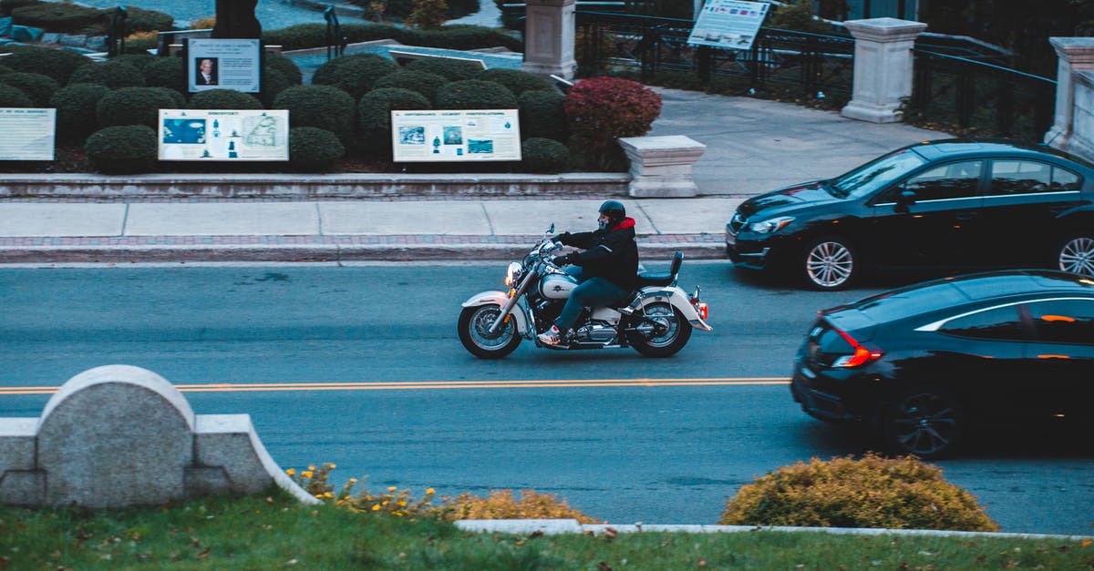 Is there a way to stop my helmet from destroying my skin in minecraft? - Unrecognizable man riding motorbike on road