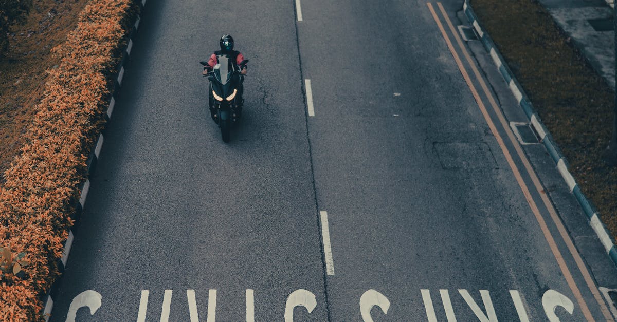 Is there a way to stop my helmet from destroying my skin in minecraft? - Faceless person riding modern motorbike on street