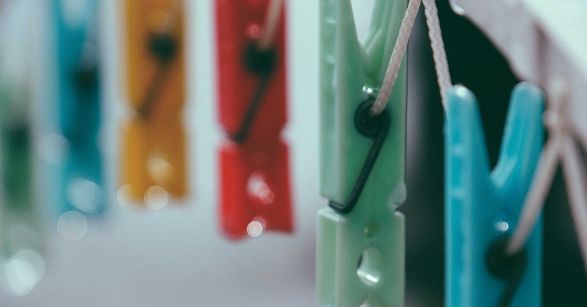 Is there a way to tell how many of an item I've bought? [closed] - Closeup of small vibrant multi colored clothespins on white thin clothesline in daylight on blurred background
