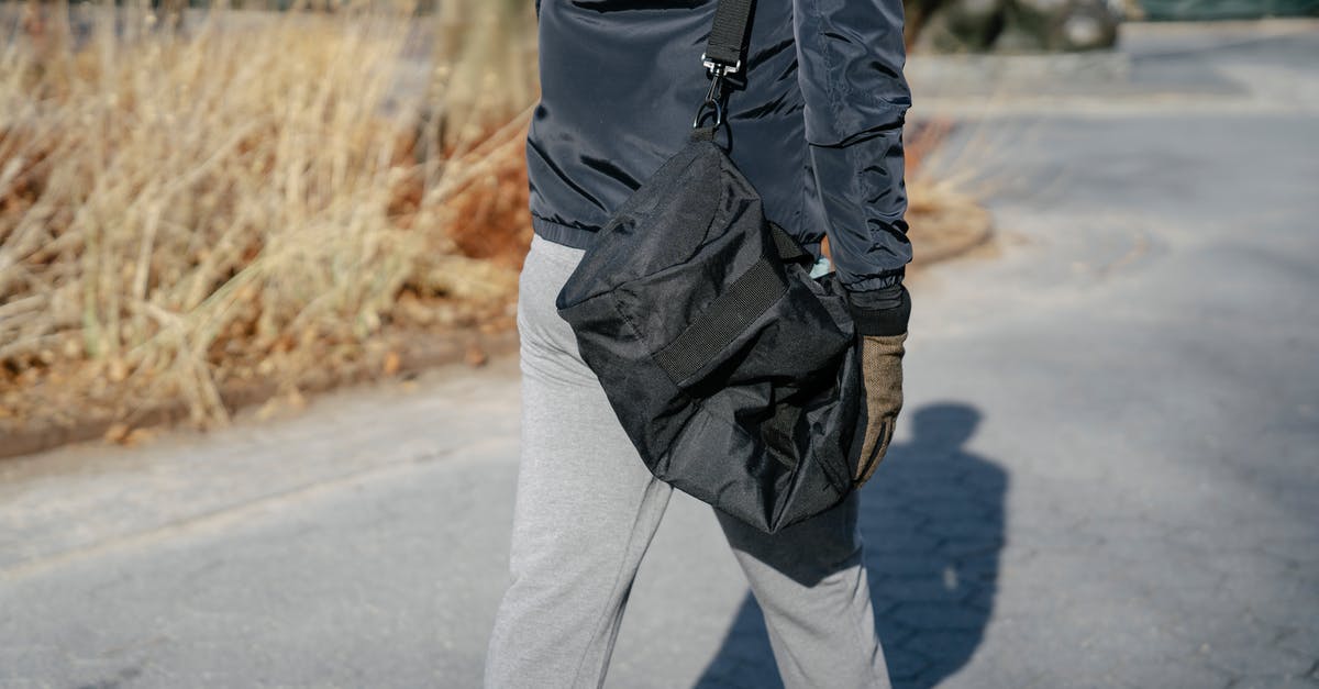 Is There a Way to tp a player back to Spawn After Falling into Void? - Crop person in outerwear walking with bag in autumn Is There a Way to tp a player back to Spawn After Falling into Void? - Crop person in outerwear walking with bag in autumn