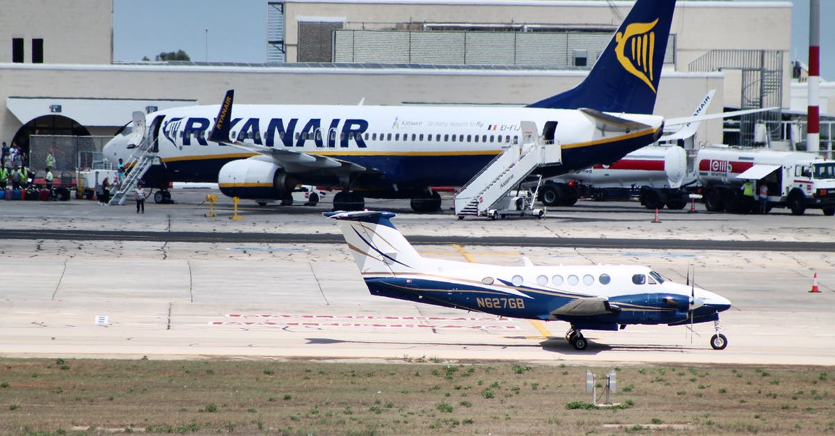 Is there a way to transfer more than one Pokemon at a time? - Civil utility and narrow body aircraft parked on runway tracks near modern airport building against cloudless blue sky