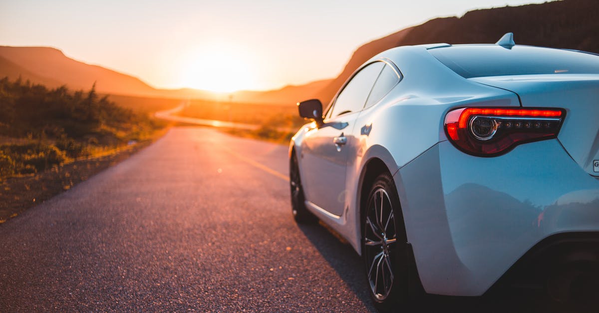 Is there a way to unlock higher graphics settings? - Modern white automobile riding on empty roadway among green plants at sundown time with sun setting on horizon in summer time Is there a way to unlock higher graphics settings? - Modern white automobile riding on empty roadway among green plants at sundown time with sun setting on horizon in summer time