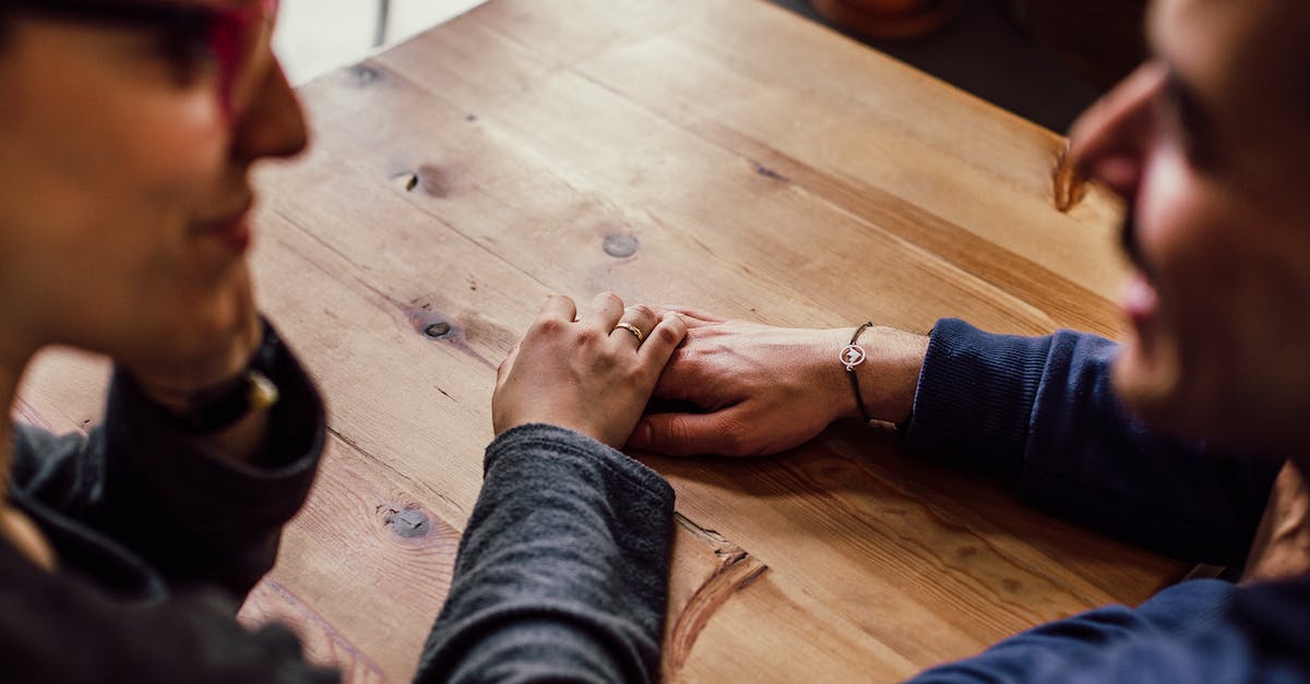 Is there a wood elf wife that you can marry? [duplicate] - Man and Woman Sitting Together in Front of Table