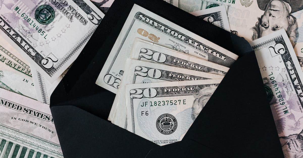 Is there a workaround for the Piggy Bank crash on consoles? - From above of dollar bills in opened black envelope placed on stack of United states cash money as concept of personal income