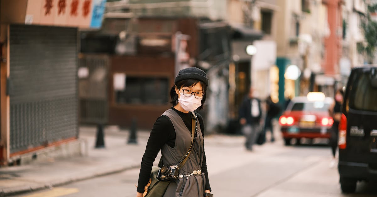 Is there an Animal Crossing City Folk face guide? - Asian Woman in Specs and Face Mask Crossing Street in Chinese City