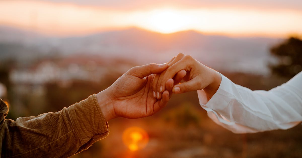 Is there an expiry date on Twitch benefits? - Unrecognizable couple holding hands at sunset