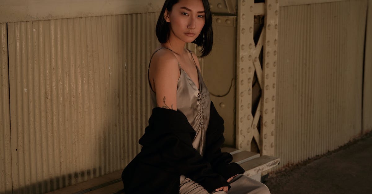 Is there any advantage to lingering in sandbox mode? - Woman in Black and White Spaghetti Strap Dress Sitting on Brown Wooden Stairs