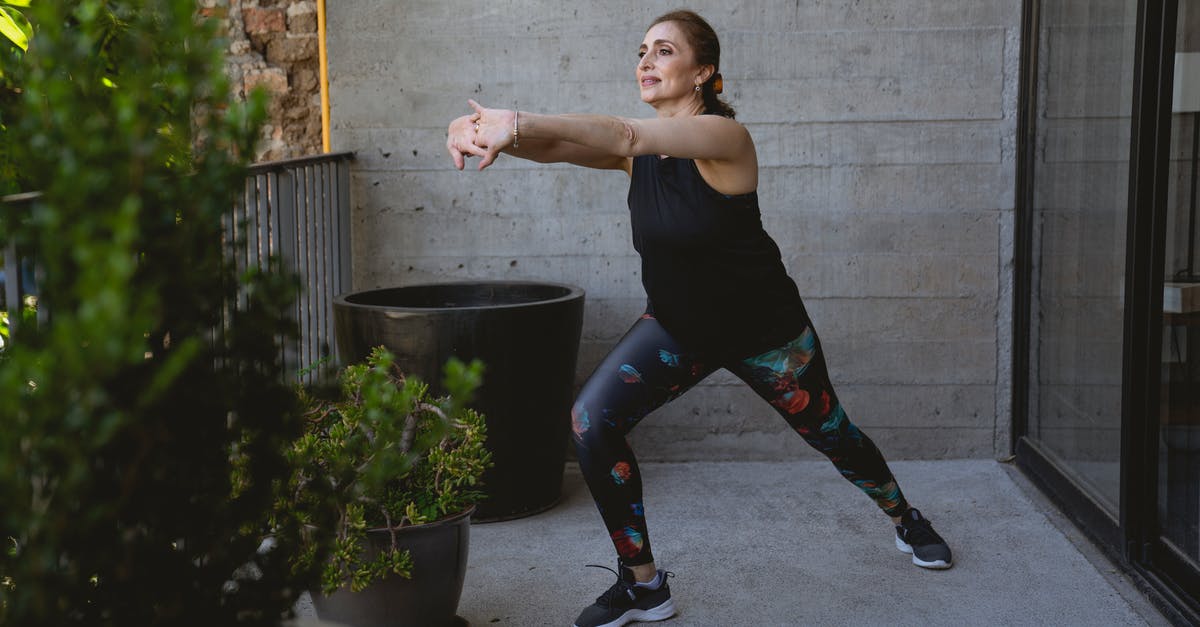 Is there any benefit of stretching out the kill shot? - Woman in Black Tank Top Working Out 