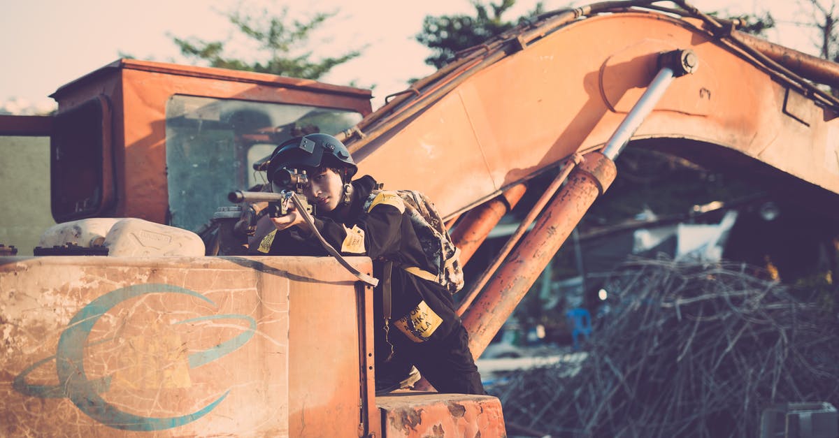 Is there any benefit to equipping the Range Finder on a Sniper Rifle? - Man in Black Jacket and Pants Riding on Orange Heavy Equipment