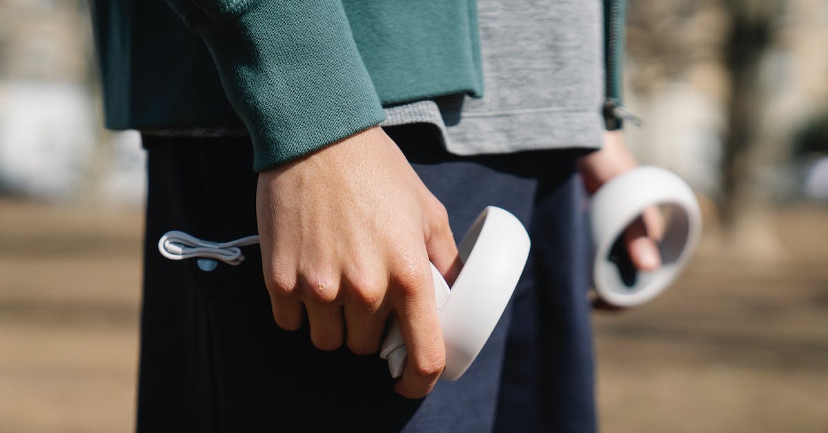 Is there any chance to play Gwent again with the guy in White Orchard? - Crop anonymous male playing with white round shaped controller on blurred background in daytime Is there any chance to play Gwent again with the guy in White Orchard? - Crop anonymous male playing with white round shaped controller on blurred background in daytime