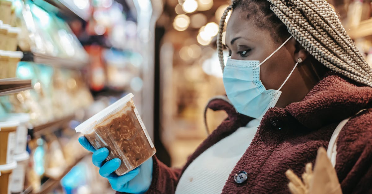 Is there any down side to robbing black markets? - Black woman checking ingredients and manufacturing date of product Is there any down side to robbing black markets? - Black woman checking ingredients and manufacturing date of product