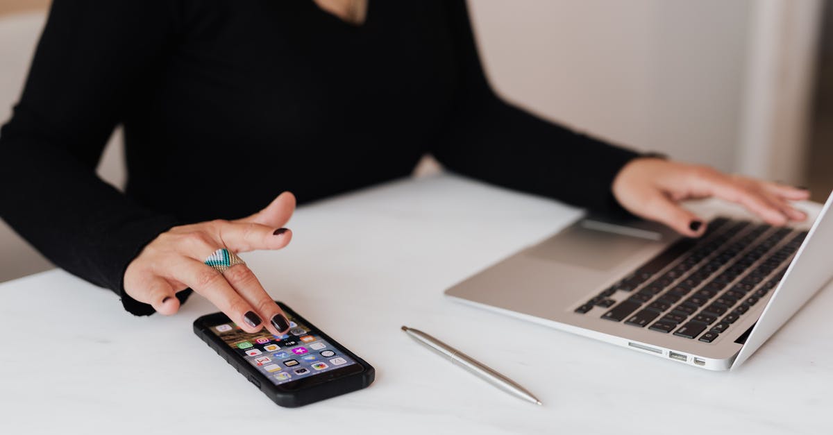 Is there any information known about the weapons used by Tempestarii? - Crop woman using smartphone and laptop during work in office