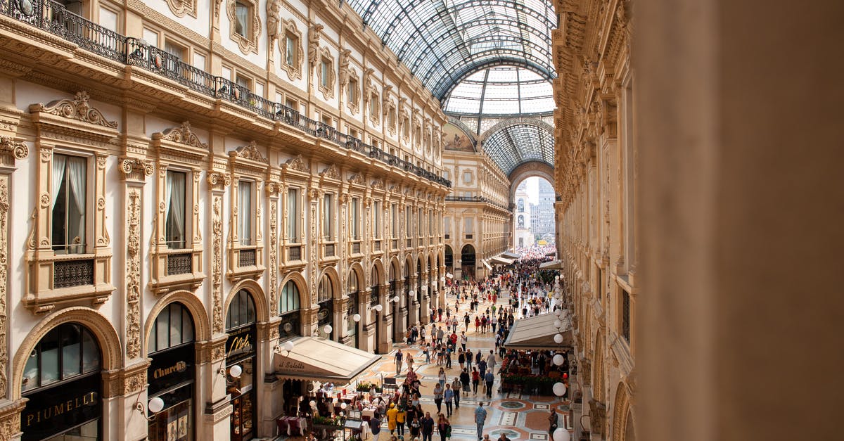 Is there any other reason to Historical Lock buildings? - People Inside Galleria Vittorio Emanuele II Shopping Mall In Italy