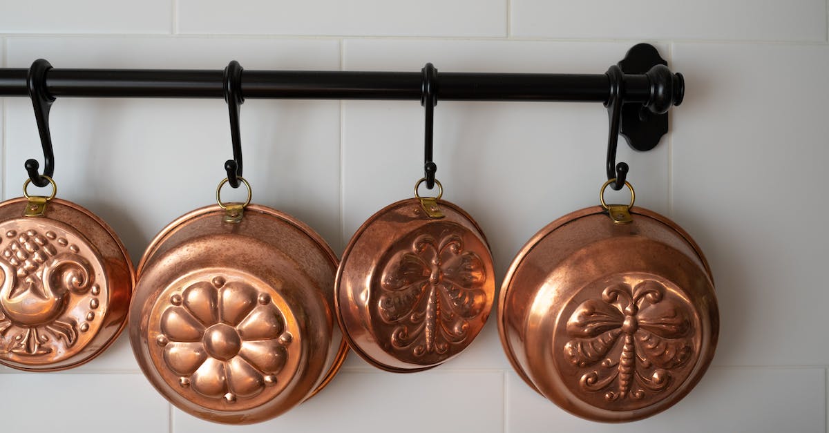 Is there any pattern to the order customization pieces unlock? - Old-Fashioned Copper Baking Pans Hanging on Wall in Kitchen Is there any pattern to the order customization pieces unlock? - Old-Fashioned Copper Baking Pans Hanging on Wall in Kitchen