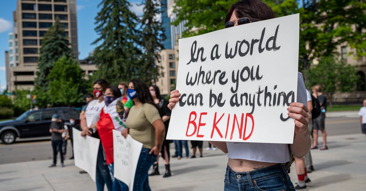 Is there any point to raise social stats to rank 5? - Anonymous social justice warriors with placards during manifestation on street Is there any point to raise social stats to rank 5? - Anonymous social justice warriors with placards during manifestation on street
