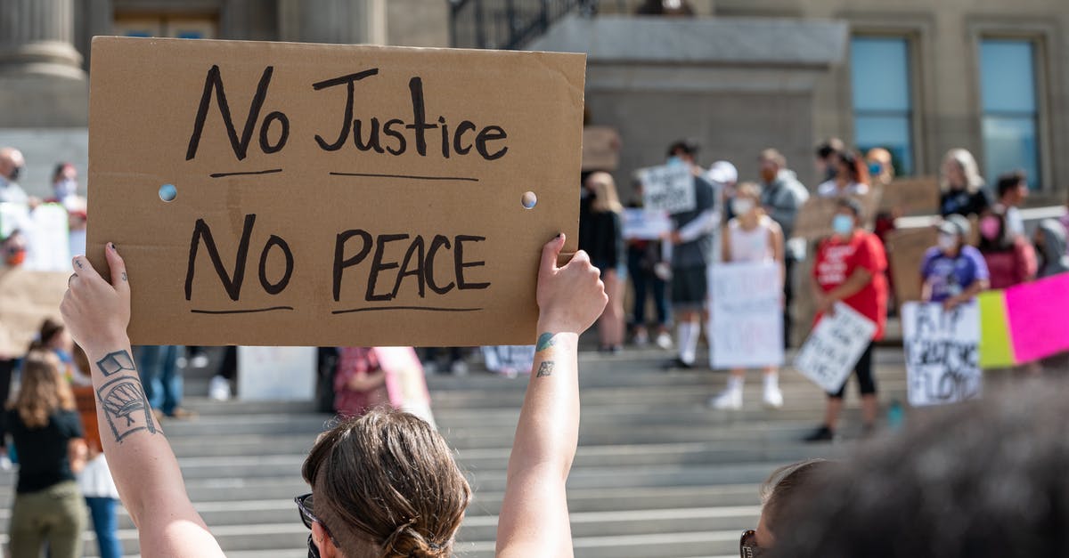 Is there any point to raise social stats to rank 5? - Unrecognizable protesters raising placards near building stairs on street Is there any point to raise social stats to rank 5? - Unrecognizable protesters raising placards near building stairs on street