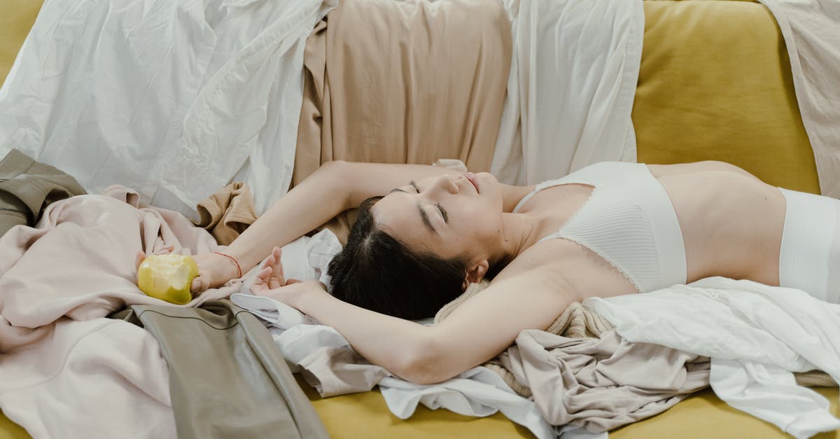 Is there any point to sleep more than an hour? - Woman in White Tank Top Lying on Bed