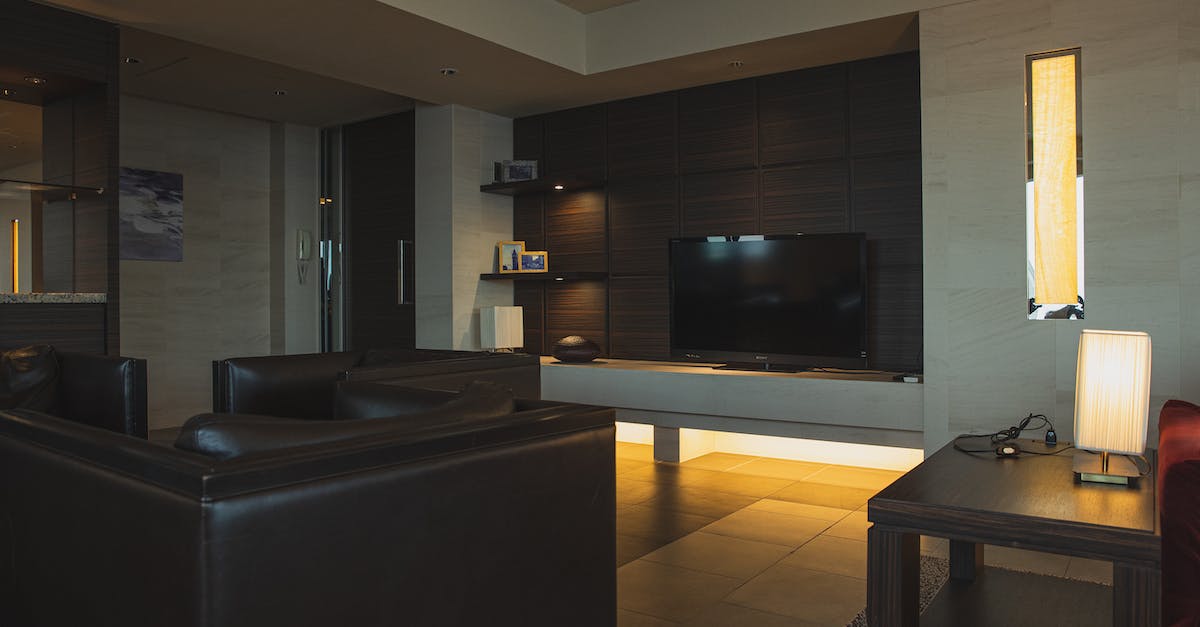 Is there any reason to place more expensive Smurf houses? - Interior of modern apartment with comfortable leather sofa and armchairs and other modern furniture and tv Is there any reason to place more expensive Smurf houses? - Interior of modern apartment with comfortable leather sofa and armchairs and other modern furniture and tv